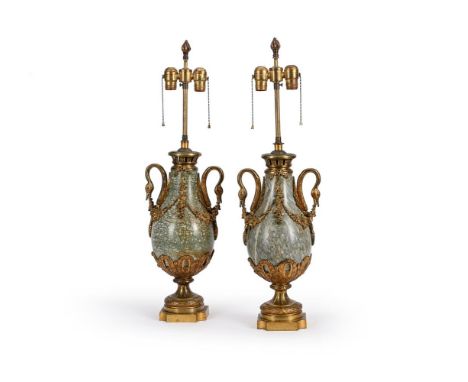 A PAIR OF FRENCH GILT METAL MOUNTED HARDSTONE TABLE LAMPS  LATE 19TH OR EARLY 20TH CENTURY  In the Empire manner with urn sha