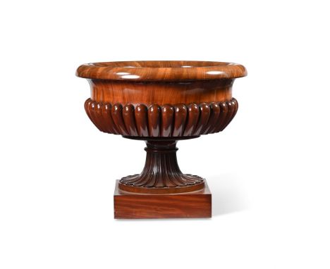 A GEORGE IV MAHOGANY WINE CISTERN  BY GILLOWS, CIRCA 1825  61cm high, 70cm diameterProvenance: Purchased from John Bell of Ab