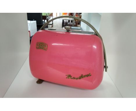 A Zeiss Ikon Movilux projector in pink 