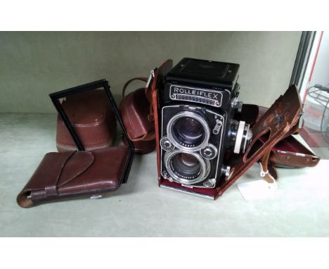 A Rolleiflex 2,8 E2 twin lens reflex camera, with Schneider Xenotar 80mm lens and Heidosmat 80mm, with accessories 