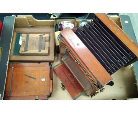 A "The International" mahogany field camera with accessories 