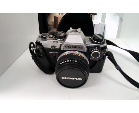 An Olympus OM-10 camera with 50mm lens and manual adaptor 