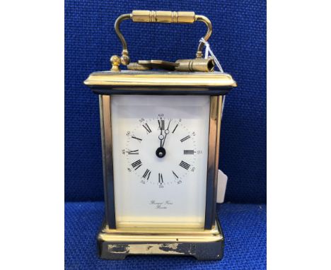 BERNARD FRERES OF BICESTER BRASS CARRIAGE CLOCK WITH ROMAN NUMERAL DIAL AND KEY