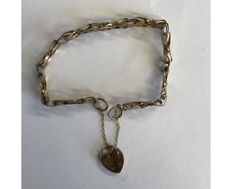 9CT YELLOW GOLD THREE STRAND GATE BRACELET WITH HEART PADLOCK AND SAFETY CHAIN, 5.2G APPROX