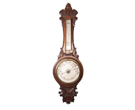 EARLY TWENTIETH CENTURY THOMAS ARMSTRONG &amp; BROTHERS, MANCHESTER, CAVED OAK CASED ANEROID BANJO BAROMETER, with mercury th