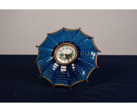 UNUSUAL CIRCA 1930's MOULDED BLUE GLASS AND GILT METAL UMBRELLA SHAPED DRESSING TABLE CLOCK centred with a white enamel/ceram