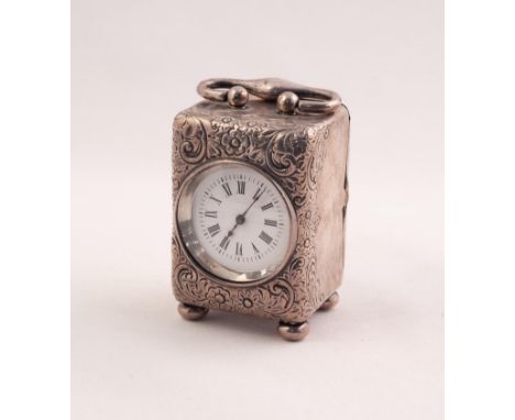 LATE VICTORIAN TINY SILVER CASES CARRIAGE CLOCK, THE WHITE ENAMEL DIAL WITH ROMAN NUMERALS WITHIN A SURROUND OF FOLIATE SCROL