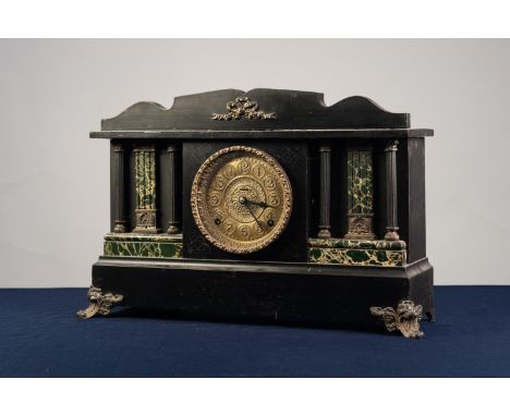 LATE NINETEENTH CENTURY EBONISED WOOD AND METAL MOUNTED ARCHITECTURAL MANTLE COCK, 20" (51cm) long 
