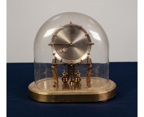 MODERN KUNDO LACQUERED BRASS ANNIVERSARY CLOCK, beneath a glaze dome, 9 1/4 (23.5cm) overall, also a small modern 'Astral' br