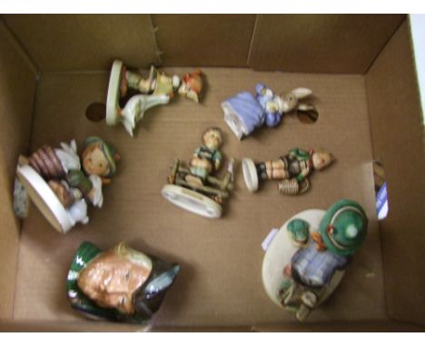 A collection of ceramic figures to include Goebel figure of boy on fence, similar Goebel figures , Royal Albert bunnykin Cott