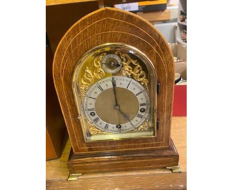 Inlaid Oak Cased Mantle Clock on Brass bracket feet (1 hand is loose and needs re attaching). 