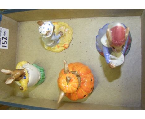 A collection of 4 Royal Doulton Bunnykins Figures 'Sundial Bunnykins' 'Halloween Bunnykins' 'Seaside Bunnykins' and 'Easter G