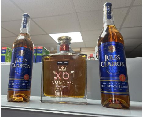 2 bottles of Jules Clairon brandy together with a bottle of kirkland XO cognac. 