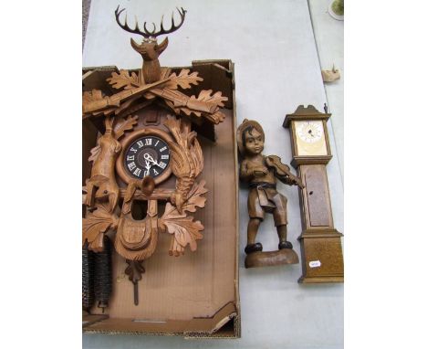 A Wall Mounted Black Forest Type Cuckoo Clock together with Miniature Grandfather clock(a/f) and Spanish Carved Wooden Figure