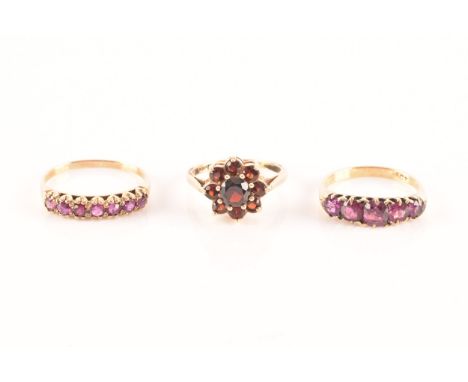 An 18ct yellow gold and purple spinel five stone ring, set with mixed cushion and round-cut spinels, together with a yellow m