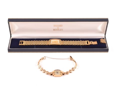 A mid 20th century 9ct yellow gold J W Benson ladies watch with curved glass, fancy link bracelet, hallmarked to clasp, toget