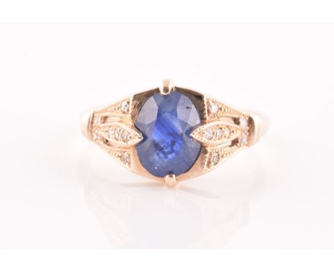 A yellow metal and sapphire ring, set with a mixed oval-cut sapphire, the mount inset with round brilliant-cut diamond accent
