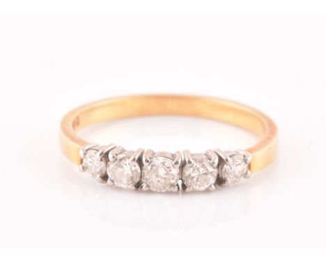 An 18ct yellow gold and diamond ring, set with five graduated round-cut diamonds, the central diamond approximately 0.18 cara