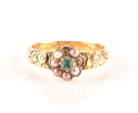 A late Georgian / early Victorian yellow gold, pearl, and green paste gemstone ring, the floral cluster centred with a green 