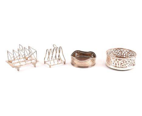 A collection of silver items including two bottle coasters and two toast racks, the coasters hallmarked Sheffield 1840 by&nbs
