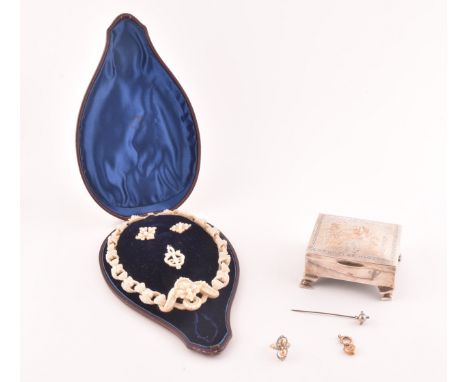 A late 19th century seed pearl necklace (lacking pendant), the curved links sewn with pierced seed pearl beads, together with