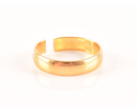 A 22ct wedding band ring, approximately size P 1/2, band 4.8 mm wide, (shank split).  Condition Report: 4.2 grams