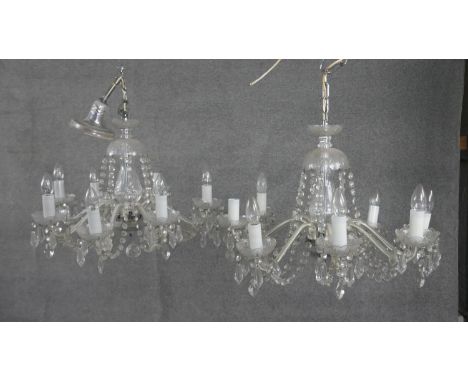 A pair of vintage cut crystal and cane glass eight branch chandeliers with hanging crystal drops and swags. H.49 W.58cm 