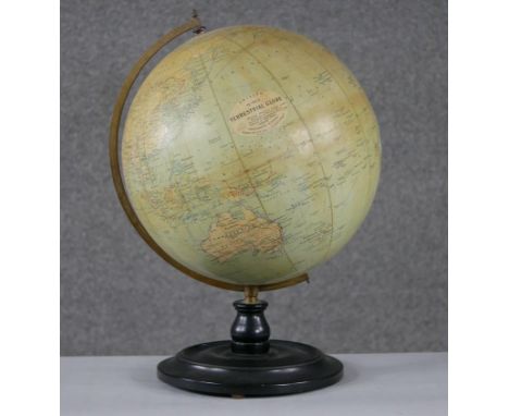 An early 20th century Philips' 12" Terrestrial Globe on ebony stand, no.2615, showing 'Principal Steamship Routes with distan