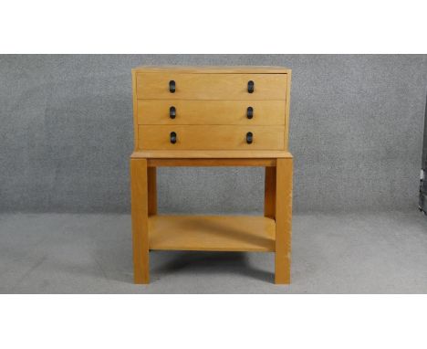 A mid century vintage Remploy teak chest on stand. H104 W.70 D.39cm 