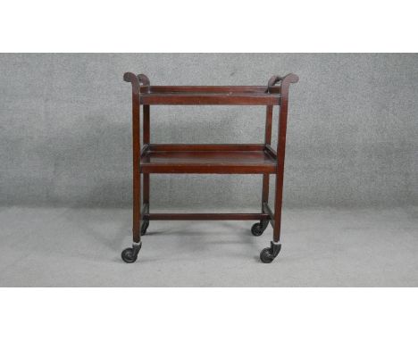 A vintage mahogany two tier trolley on wheel casters. H.87 W.75 D.40cm 