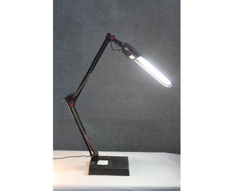 A black LED anglepoise style strip lamp on weighted base. H.95 W.20cm. 