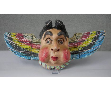 A large vintage painted hardwood Mexican angel mask. 
H.29 W.67 D.21cm 