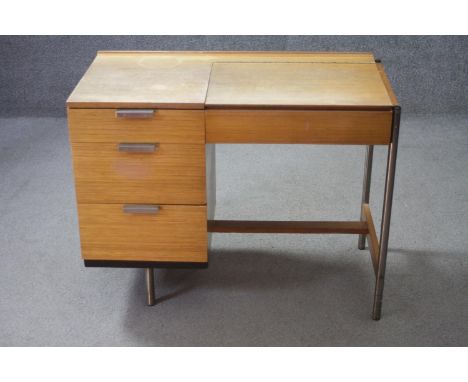 A 1960's vintage teak Stag Fineline metal framed dressing table with lift up vanity mirror by John and Sylvia Reid. H.71 W.91