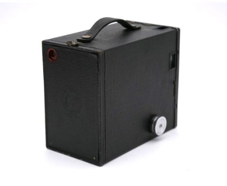 A vintage brownie camera with its brown leather case. H.12 W.17 D.19cm 