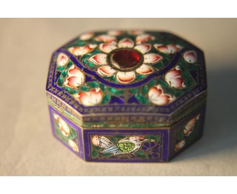 A Mogul style octagonal Indian silver and enamel snuff box, decorated with birds and lotus flowers. Gilded and engraved inter