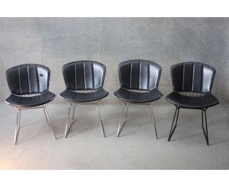 A set of four vintage Harry Bertoia model 420c dining chairs on metal wirework frames. Comes with original Form International