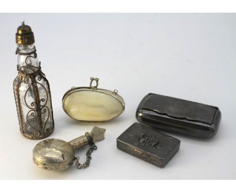 A collection of white metal and silver plate items. Including a white metal relief scene snuff box along with two scent bottl
