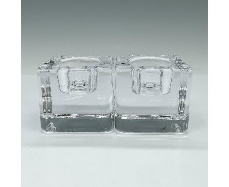 The Ice Cube Votive candle holder enhances the unique refractive qualities of crystal by shaping it into a massive cube, crea