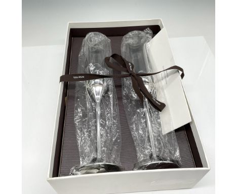 In original packaging the flutes have clear crystal set in .999 pure silverplated holloware stem with bow. Vera Wang impresse