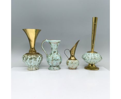 A stunning set of four turquoise colored ceramic pitchers and vases with elegantly embellished with a mesmerizing root art pa