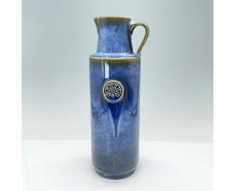 Stunning vintage coffee pitcher, meticulously handcrafted and glazed in a captivating blue with subtle brown tones along the 