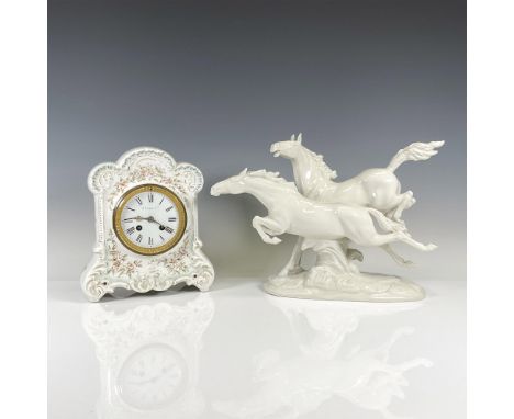 Beautiful, detailed white porcelain statue of two horses in motion. Hutschenreuther backstamp. Ornate mantel clock in decorat