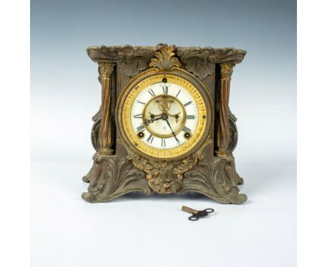 Original Art Nouveau style Ansonia cast-iron and brass mantle clock. Features floral designs on all sides with raised columns