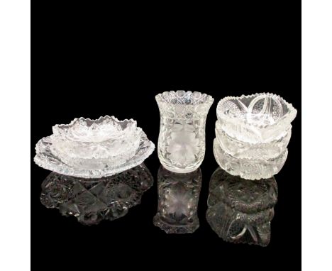 Deep cut glass in geometric patterns and floral etching design. Two of the bowls and the vase have minor chips. Three bowls 2
