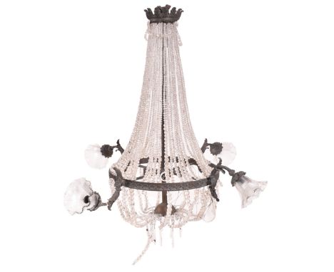 A mid century French Empire style ormolu and crystal drop bag chandelier. The pendant chandelier featuring crown fleur de lis