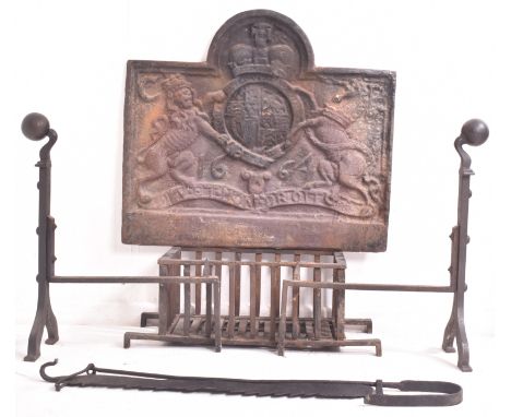 A late 19th / early 20th century cast iron fire grate with andirons and Pot Jack. The fire set comprising of moulded back wit