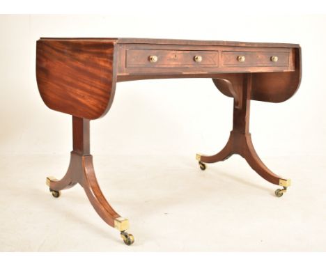 A George III 18th century flame mahogany drop leaf sofa table desk. The table having a rectangular top with short drop leaves