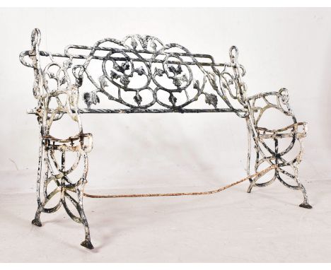 A Victorian 19th century Coalbrookedale manner white painted reclaimed cast iron garden bench. The bench with intricate scrol