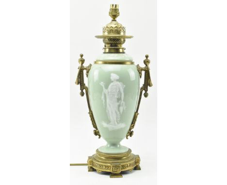 A late 19th century / early 20th century gilt metal mounted&nbsp;p&acirc;te sur p&acirc;te celadon ceramic desk lamp light. T