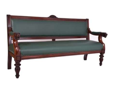 A large Victorian 19th century mahogany hall settle bench settee. The settle having carved lunette shaped embellishment atop 
